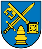 Wappen: Auf blauem Grund, über einem goldenen Salbgefäß schräg gekreuzt ein goldener Schlüssel und ein goldenes Schwert. 